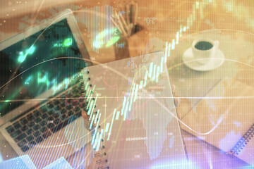 Double exposure of businesswoman hands typing on computer and forex chart hologram drawing. Financial analysis concept.