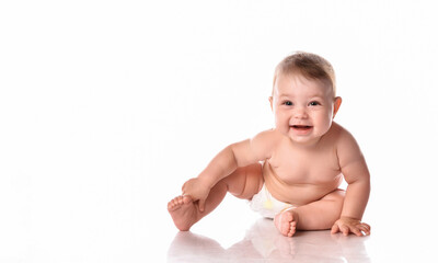cute toddler baby in diapers smiling happily on white background