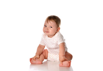 Little baby girl child on floor studio portrait