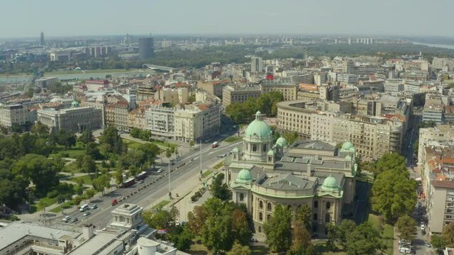 
Aerial shot Belgrade Serbia. Beautiful drone flight over the parliament building, where you can see the streets, the old building on the background of houses and the city with a beautiful urban lands