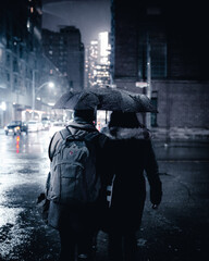 Fototapeta na wymiar couple under the rain with one umbrella