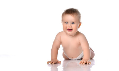 Little baby child smiling and crawling isolated on white in studio.