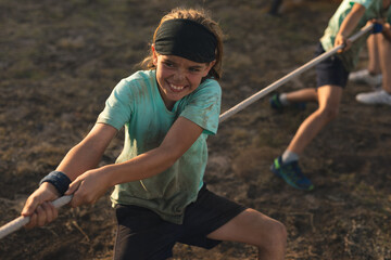 Girl pulling rope at boot camp