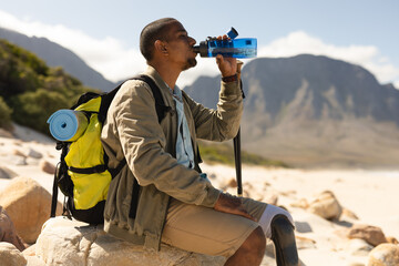 Disabled Black African American male athlete drinking