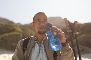 Disabled Black African American male athlete holding bottle