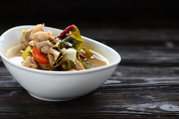 Thai food Pork spare rib Spicy soup in white bowl.