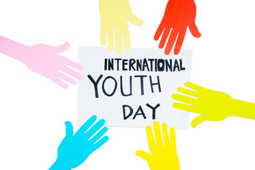 Colorful hands with International Youth Day text