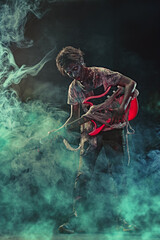 teen zombie plays guitar