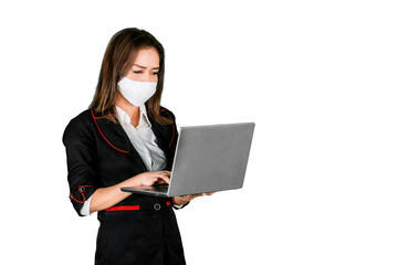 Fototapeta premium Female manager wear mask while use laptop on studio