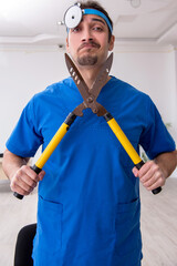 Young male doctor working in the clinic