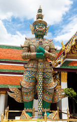 Fototapeta na wymiar Demon Guardian in Temple of the Emerald Buddha (Wat Phra Kaew) Bangkok Thailand Traditional religious architecture of Asia Tourist destination