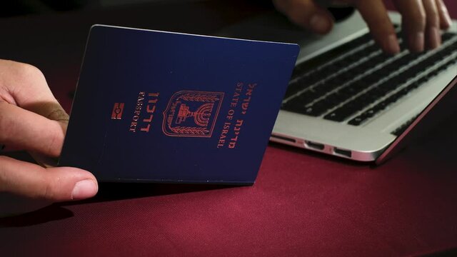 Israeli citizen insert data from International Travel document Passport for buy ticket or registration. Visa Application online Form Immigration Concept