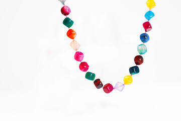 colorful stone necklace on white background