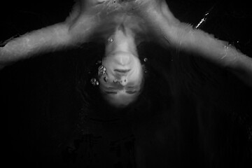 drowning human, body in deep water