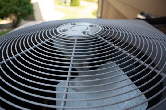 Top view of  Residential air conditioning unit outdoors with fan and coils