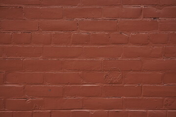Fototapeta premium red brick wall background with a brick pattern and red-colored smooth texture