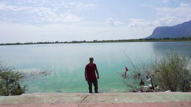 man at Vadatalav lake in triple role