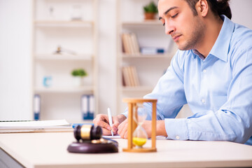 Young man in courthouse in divorcing concept