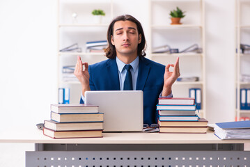 Young businessman student studying at workplace