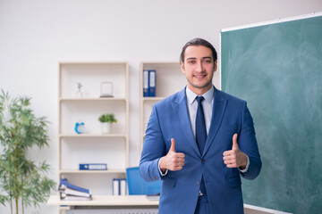 Young man employee in business presentation concept