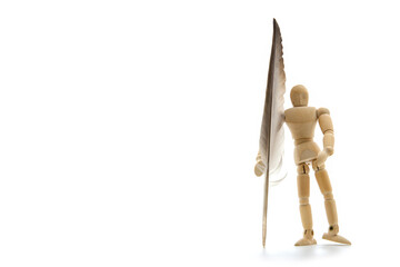 Wooden figure businessman holding feather for signed and approve