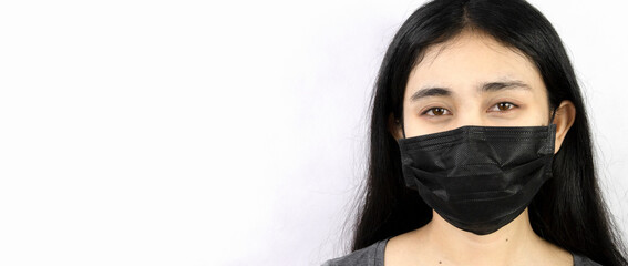 Woman wearing a face mask carbon white background Health and personal concept.