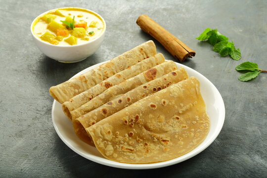 Top view- Indian street foods background- chapathi or chapati served with mixed vegetable curry.