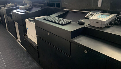 Office counter with free equipment on the black table.