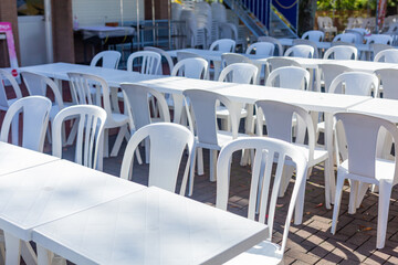 a lot of empty chairs and tablein terrace of restaurant on mount takao, tokyo, japan