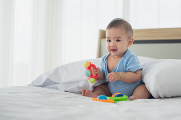 portrait baby girl playing toys