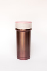 Pink thermos travel tumbler isolated on white background.