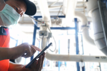 lady engineer scanning information using smartphone.