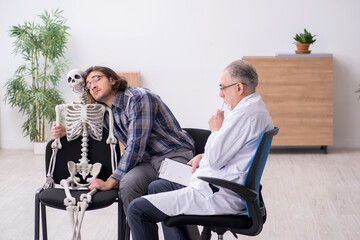 Young male patient visiting experienced doctor psychiatrist