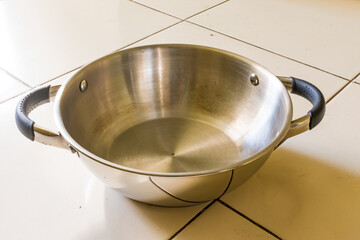 new pan made in stainless steel with chrome plated looking beautiful in floor.
