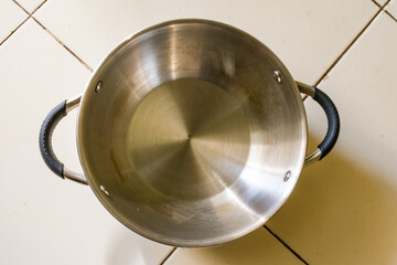 new pan made in stainless steel with chrome plated looking beautiful in floor.
