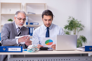 Two accountants working in the office