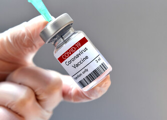 Coronavirus vaccine vial in laboratory.