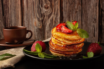 Delicious, only baked pancakes with fresh aromatic strawberries