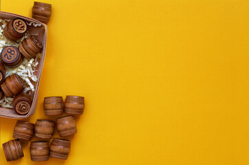 wooden Lotto barrels on a yellow background