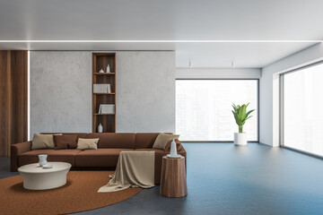 Concrete and brown living room with window