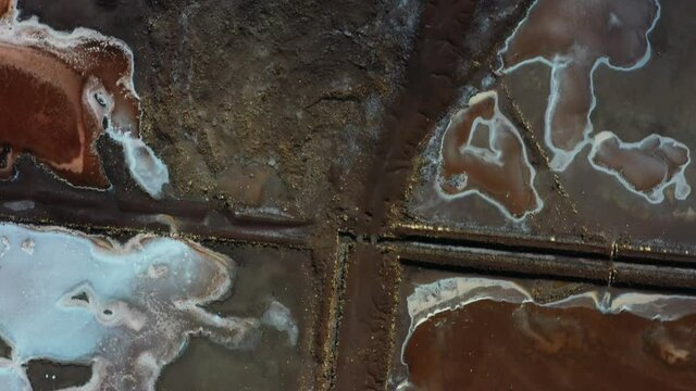 Aerial top down shot of the Pedra de Lume salt evaporation ponds, inside the crater of an extinct volcano.