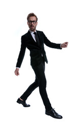 cool young businessman in black suit looking to side