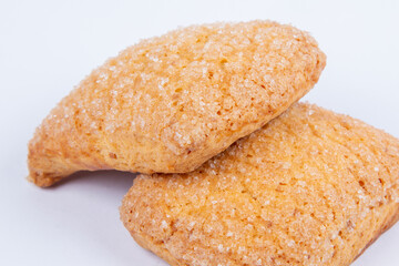 fresh sweet cookies, sprinkled with sugar, isolated on a white background