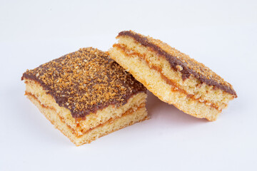 fresh pastry filled with boiled condensed milk, poured with chocolate, isolated on a white background