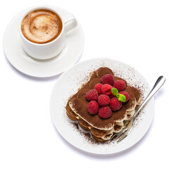 portion of Classic tiramisu dessert with raspberries and cup of fresh hot espresso isolated on white background - clipping path