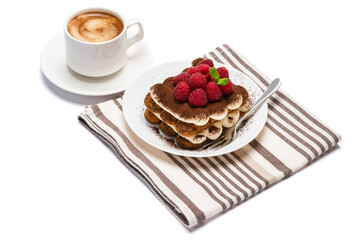 portion of Classic tiramisu dessert with raspberries and cup of fresh hot espresso isolated on white background - clipping path