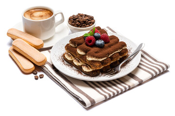 portion of Classic tiramisu dessert with raspberries, blueberries and cup of fresh hot espresso isolated on white background - clipping path