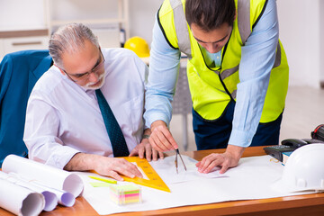 Two male architects working in the office