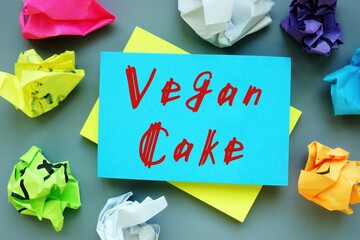 Vegan concept about Vegan Cake with phrase on the piece of paper.