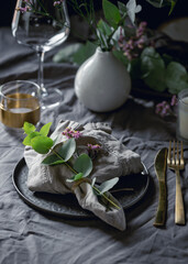 Festive table setting with floral decor. The concept of Thanksgiving or wedding dinner.